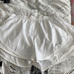 White Nike running shorts